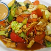 Pad Pra Ram · Stir fried mixed vegetables served with peanut sauce.Add beef, pork, shrimp for an additiona...