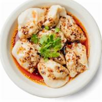 Chili Dumplings (8Pc) · pork and cabbage dumplings in spicy chili oil topped with scallions and cilantro