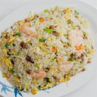 House Fried Rice · Fried rice with shrimp, bbq pork, beef, chicken, peas, carrots, and scallions.