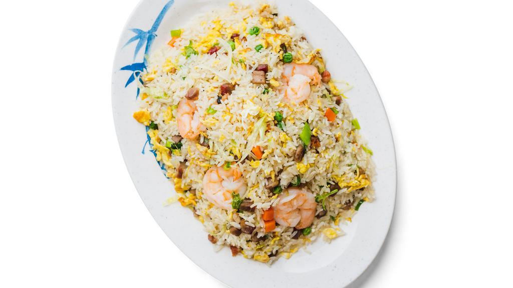 Yang Zhou Fried Rice · Fried rice with shrimp, Chinese sausage, peas, carrots, lettuce and scallions.