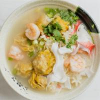 Seafood Wonton Noodle Soup · Hand-wrapped pork and shrimp wontons with handmade egg noodles in our chicken miso broth. To...