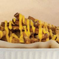 Jalapeño Cheese Hand-Cut Fries · Large portion smothered with jalapeño cheese sauce
