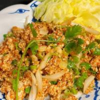 Laab (Minced Chicken Salad) · Ground chicken mixed in a lime juice sauce with toasted rice powder, green onions and mint.