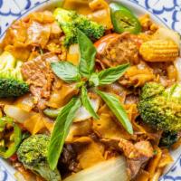 Drunken Noodle · Rice noodles stir-fried with Thai peppers, vegetables and Thai basil.