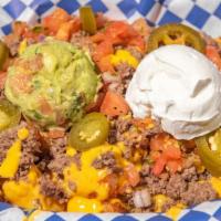 Loaded Tater Tots Platter · Heaping portion of deep fried tater tots covered with nacho cheese, ground beef our own pico...