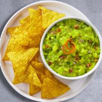 Chips & Guacamole · A heaping scoop of fresh guacamole and warm tortilla chips.