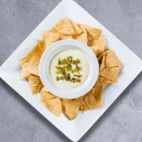 Chips & Queso · Plain chips with queso dip on the side.