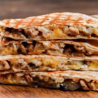 Carnitas Quesadilla · Grilled tortilla filled with shredded pork and melted cheese. Served with guacamole and sour...