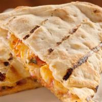 Fresh Fajita Quesadilla · Grilled tortilla filled with grilled chicken and melted cheese. Served with guacamole and so...