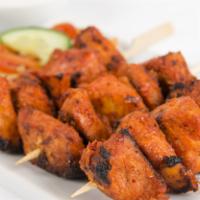 Chicken Tikka Kabab · Boneless chicken pieces, marinated in yogurt, and spices then roasted in the tandoori clay o...