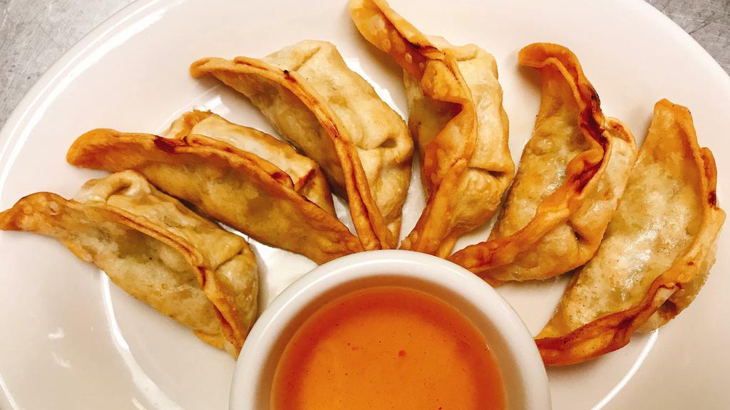 Pot Stickers · Pan-fried pot stickers with Chicken, cabbage, onion served with soy-ginger dipping sauce.