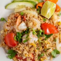 Thai Fried Rice · Jasmine rice wok with egg, tomatoes, onions, scallions and cilantro.
