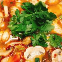 Tom Yum · Thai lemony lemongrass soup with mushroom, tomato, scallion & cilantro.