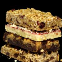Breakfast Bars · Our Gourmet Breakfast Bars are hand pressed, hand topped, and made from scratch daily. Enjoy...