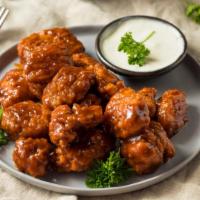 Hot Bbq Boneless Wings · Boneless! Crispy chicken wings tossed in hot BBQ sauce for flavor, served with side of ranch...