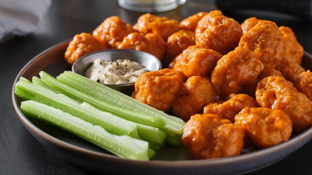 Suicide Boneless Wings · Boneless! Crispy chicken wings tossed in hot suicide sauce for flavor, served with side of ranch or bleu cheese.