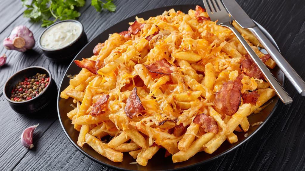 The Chicken Bacon Ranch Fries · White meat chicken, bacon, ranch dressing, topped with mozzarella & cheddar cheese!
