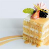Lemon Cake · Artisan layered white cake, whipped lemon custard, topped with strawberry meringue and candi...