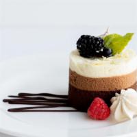 Triple Chocolate Mousse · Layers of dark, milk and white chocolate mousse, topped with a brown sugar & chocolate merin...