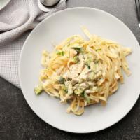 Chicken Fettuccine Alfredo · Fettuccine pasta with grilled chicken and broccoli with a creamy alfredo sauce.