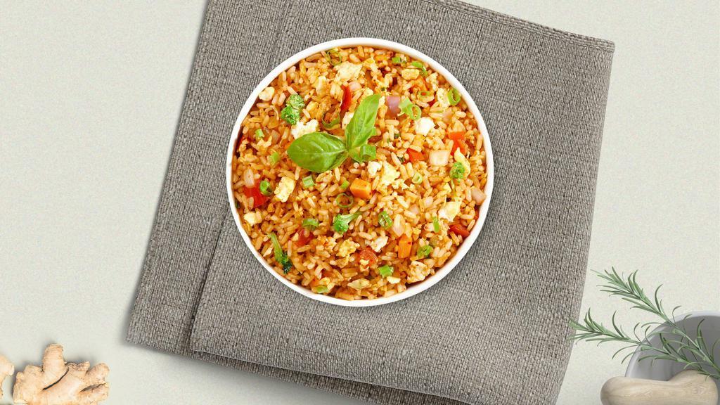 Crab Fried Rice · Stir-fried rice snow crab with egg, yellow onion, tomato, carrot and green onion.