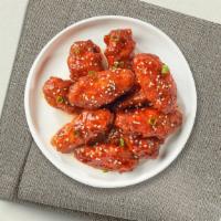 Open Sesame Chicken · Crispy chicken tossed in sweet and tangy sesame sauce.