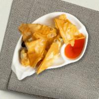 Crab Cheese Wonton · Crab meat mixed with cream cheese wrapped with wonton skin and deep fried.