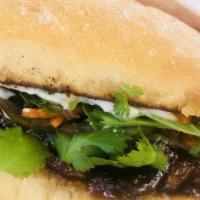 Hercules Bahn Mi · Thai glazed tempeh staked with fresh cilantro, mint, basil, house pickled cucumber and carro...