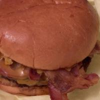 Big Ass Bacon Cheese Burger · Two or three 1/4 lb Angus patties topped with 12 strips of bacon and a 1/3 lb of cheddar che...