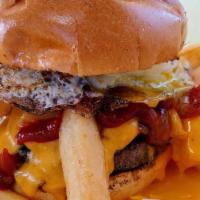 The Chipotle Burger · Outrageous! With a fried egg, grilled bacon, fresh cut fries, cheddar cheese and Sammy's spi...
