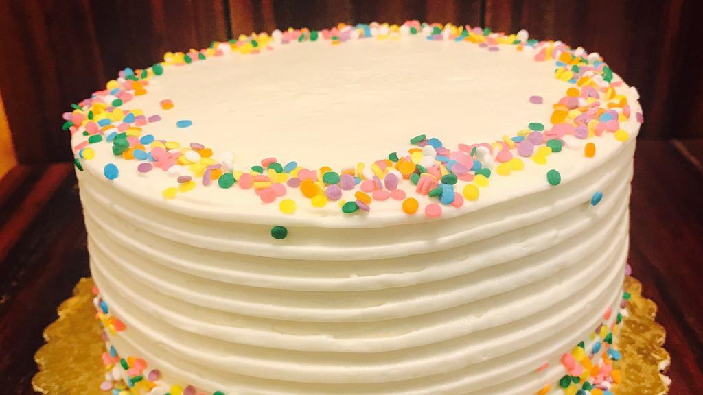 Confetti Birthday - Slice · Light sponge cake dotted with colored sprinkles, vanilla syrup, vanilla butter cream frosting, more sprinkles.
