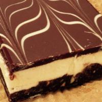 Nanaimo Bar · Layers of almond, coconut, graham cracker, and cream cheese topped with dark chocolate.
