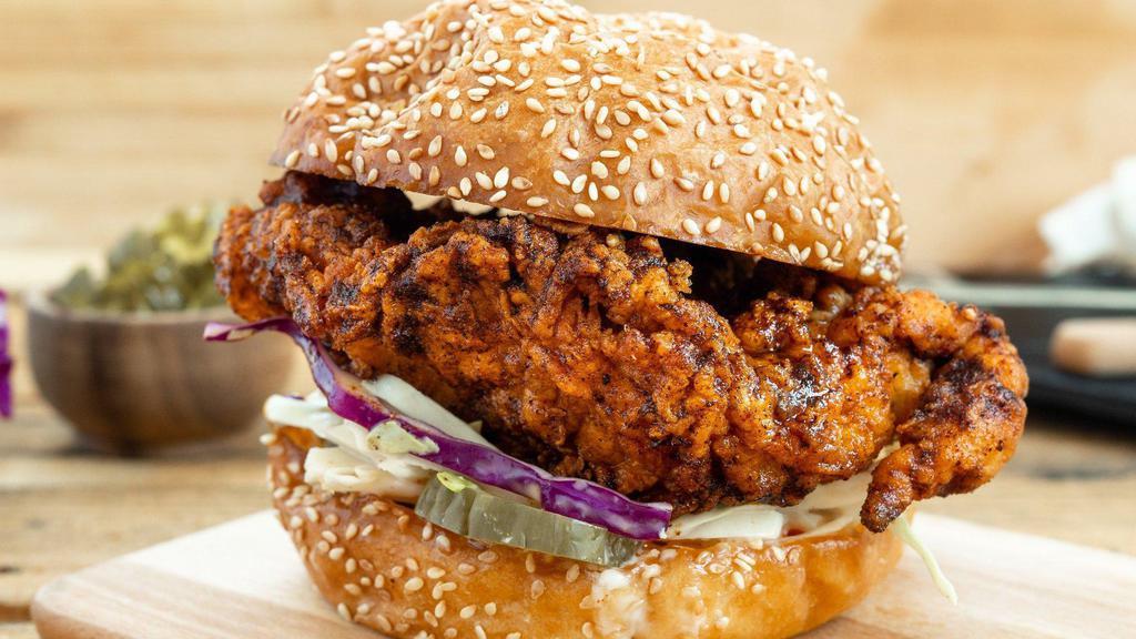 Nashville Hot Sandwich · Hot and spicy crispy Nashville chicken, served with creamy coleslaw and dill pickles.