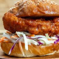 Kfc Sandwich · Korean fried chicken breast tossed in a sweet and spicy Korean Chile sauce served with pickl...