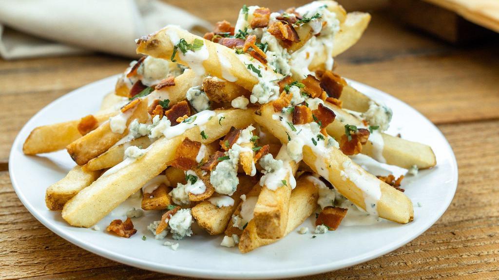 Bacon ＆ Blue Fries · Crispy natural cut fries covered in housemade blue cheese dressing, crispy bacon and more blue cheese crumbles.