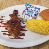 Kids Meal · One rib or chicken drumstick, one roll, juice, snack, 1/2 corn.