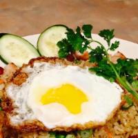 Grand Slam Fried Rice (Com Chien Dai Thanh) · Fried rice with chicken, Chinese sausage, two chicken wings, and a fried egg on top