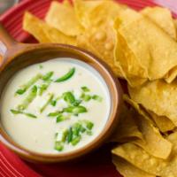 Warm Jalapeño Cheese Dip · Gluten-free. Spicy chile dusted tortilla chips.