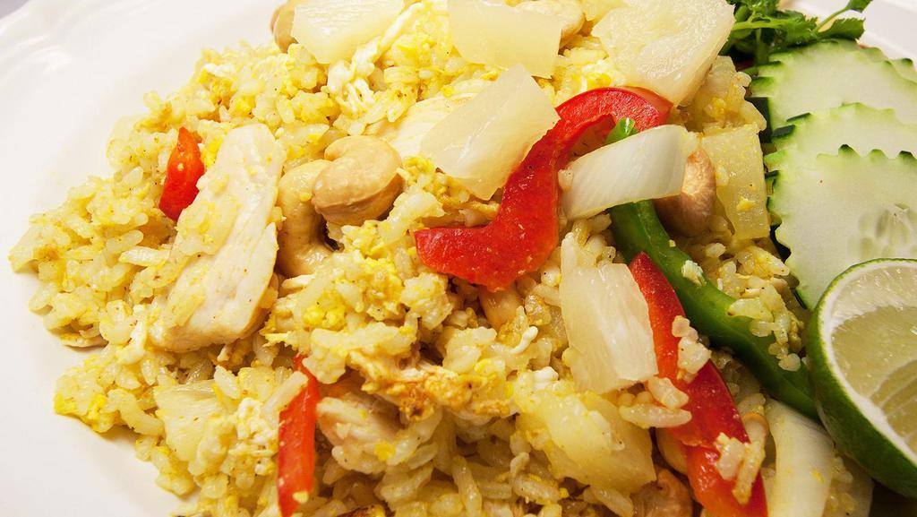 Curry Fried Rice · Eggs, bell peppers, onions, green onions, tomatoes in yellow curry powder stir fried in our signature house sauce.
