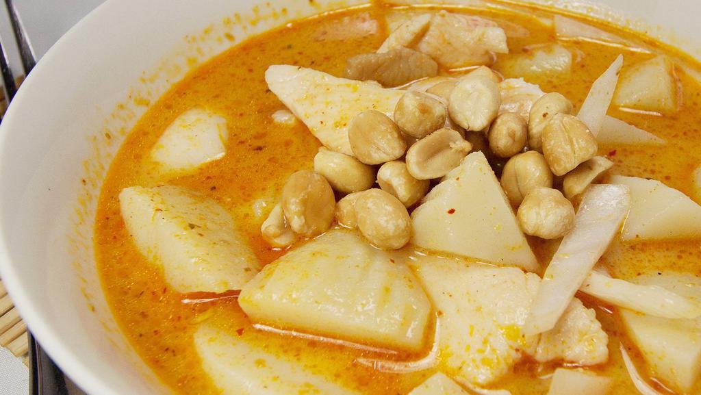 Massaman Curry · Coconut milk, onions, peanuts, and potatoes in massaman curry.