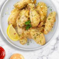 Genius Garlic Parmesan Wings · Fresh chicken wings breaded, fried until golden brown, and tossed in garlic and parmesan. Se...