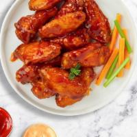 Buffalo Bureau Wings · Fresh chicken wings breaded, fried until golden brown, and tossed in buffalo sauce. Served w...