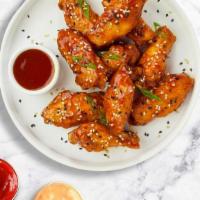 Tetra Tangy Wings · Fresh chicken wings breaded, fried until golden brown, and tossed in sweet and sour sauce. S...