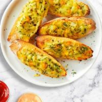 Garlic Bread With Cheese · (Vegetarian) Housemade bread toasted and garnished with butter, garlic, mozzarella cheese, a...