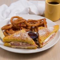 Monte Cristo Sandwich* · Thick slices of homemade brioche bread dipped in egg batter pan fried to golden brown, with ...