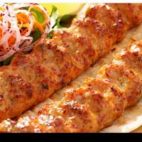 Chicken Kebab · Two piece chicken kebab over rice with salad