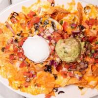 Double Barrel Nachos- Half · Try our homemade corn chips, ground beef, black beans, cheese blend, olives, pico de gallo, ...