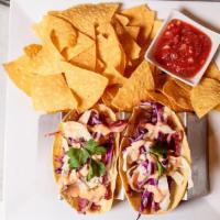 Corned Beef Taco · Slow roasted corned beef in a corn tortilla, swiss, cabbage, Russian dressing and a side of ...