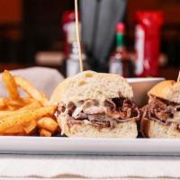 French Dip · Thinly sliced roast beef, sautéed onions, Swiss cheese and garlic aioli on a hoagie. Served ...