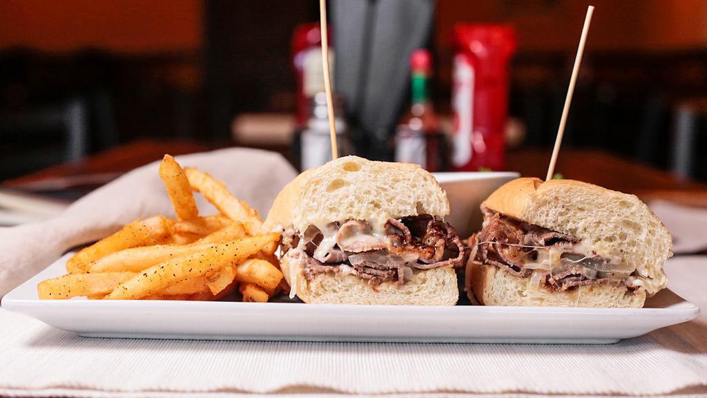 French Dip · Thinly sliced roast beef, sautéed onions, Swiss cheese and garlic aioli on a hoagie. Served with a side of au jus.